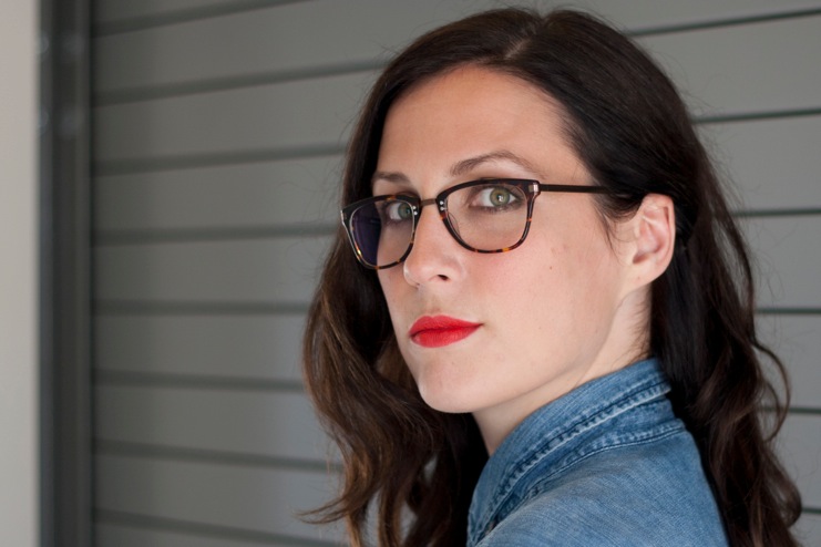 A woman wearing eyeglasses.