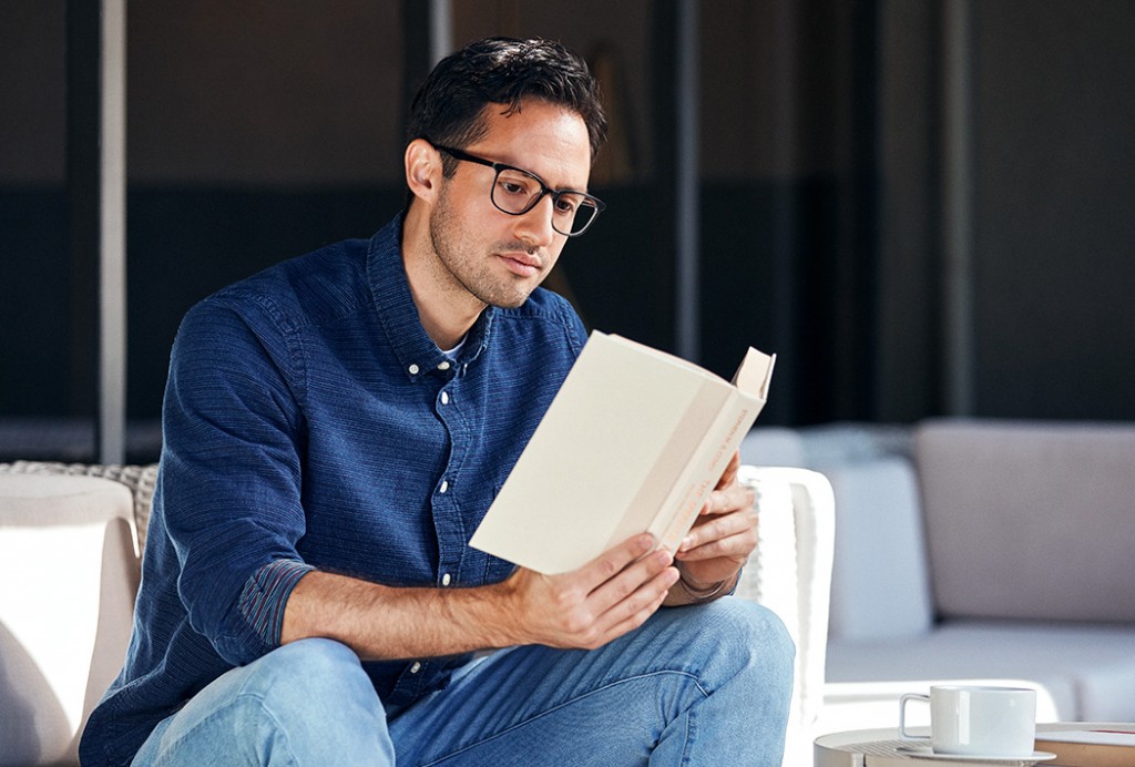 Reading a book with glasses