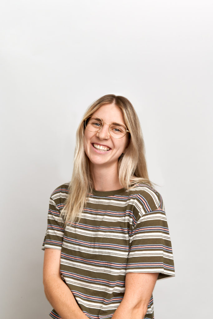 A woman with blue eyes smiling