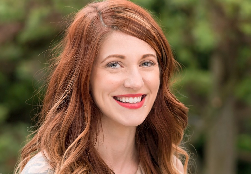 A smiling woman wearing contact lenses