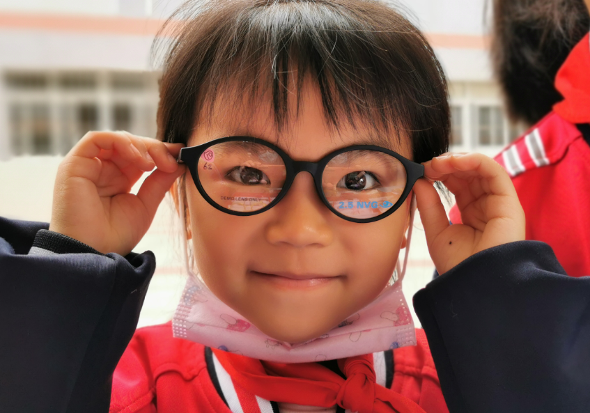 Child wearing a new pair of glasses