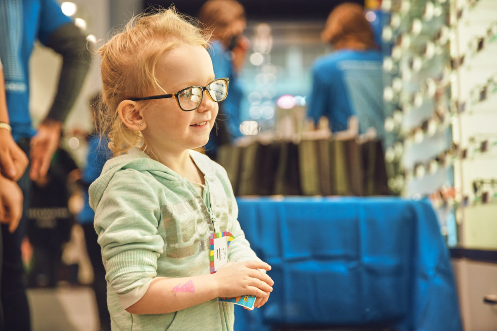 Child wearing a new pair of glasses