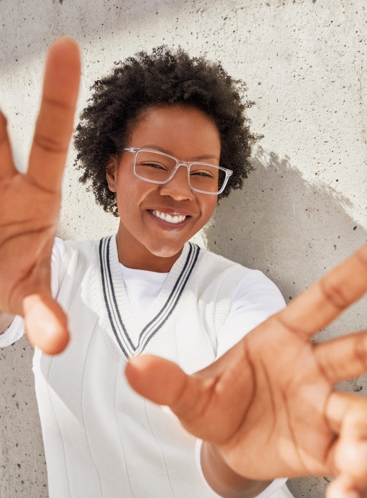 person wearing clear frame glasses