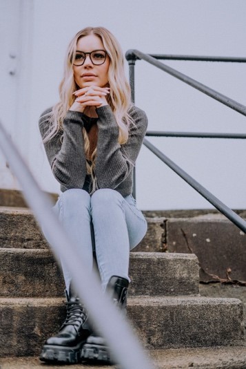 woman wears high bridge fit glasses